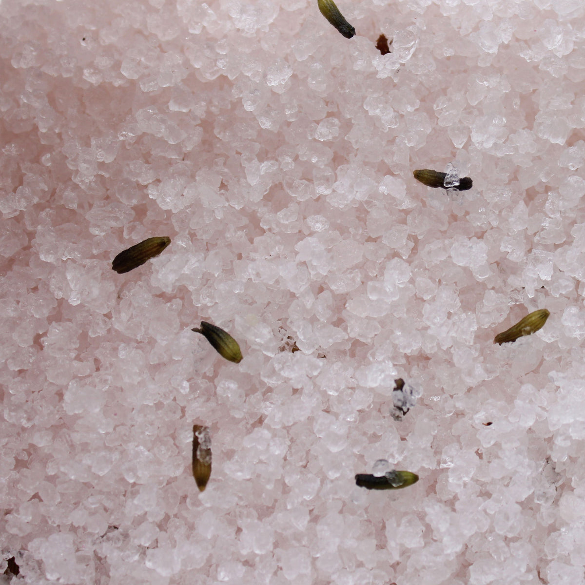 Himalayan Bath Salt Blend 500g, Relax, close-up of pale pink salt crystals with scattered seeds