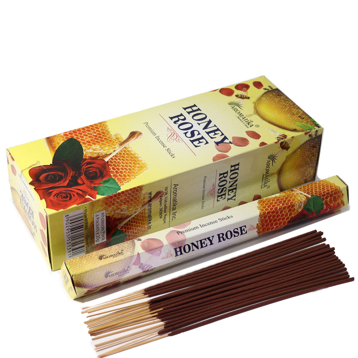 Aromatika Charcoal Free Hex Incense, Honey Rose in yellow boxes with brown sticks laid out in front