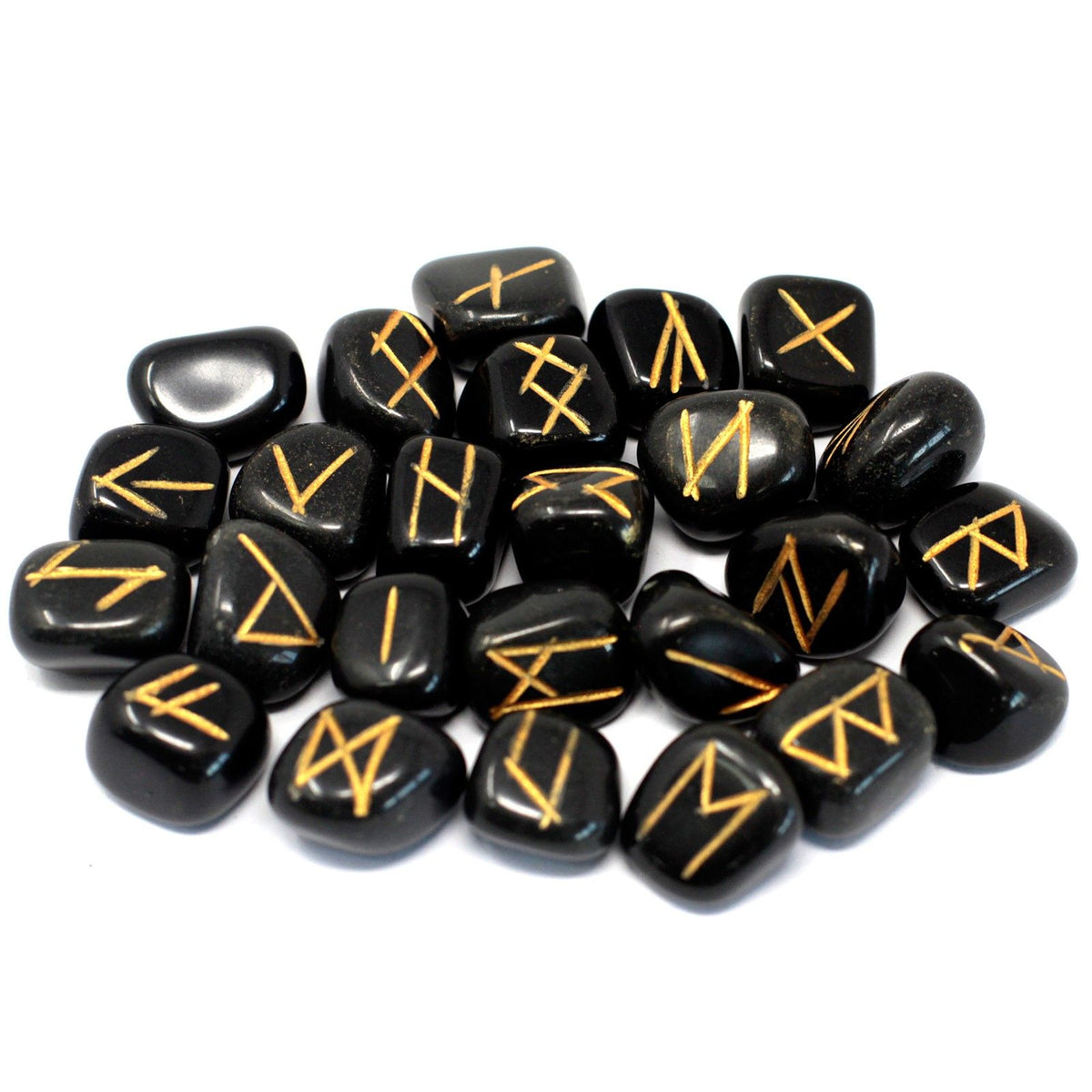 Black agate rune stones spread out on a white background, showing their gold markings