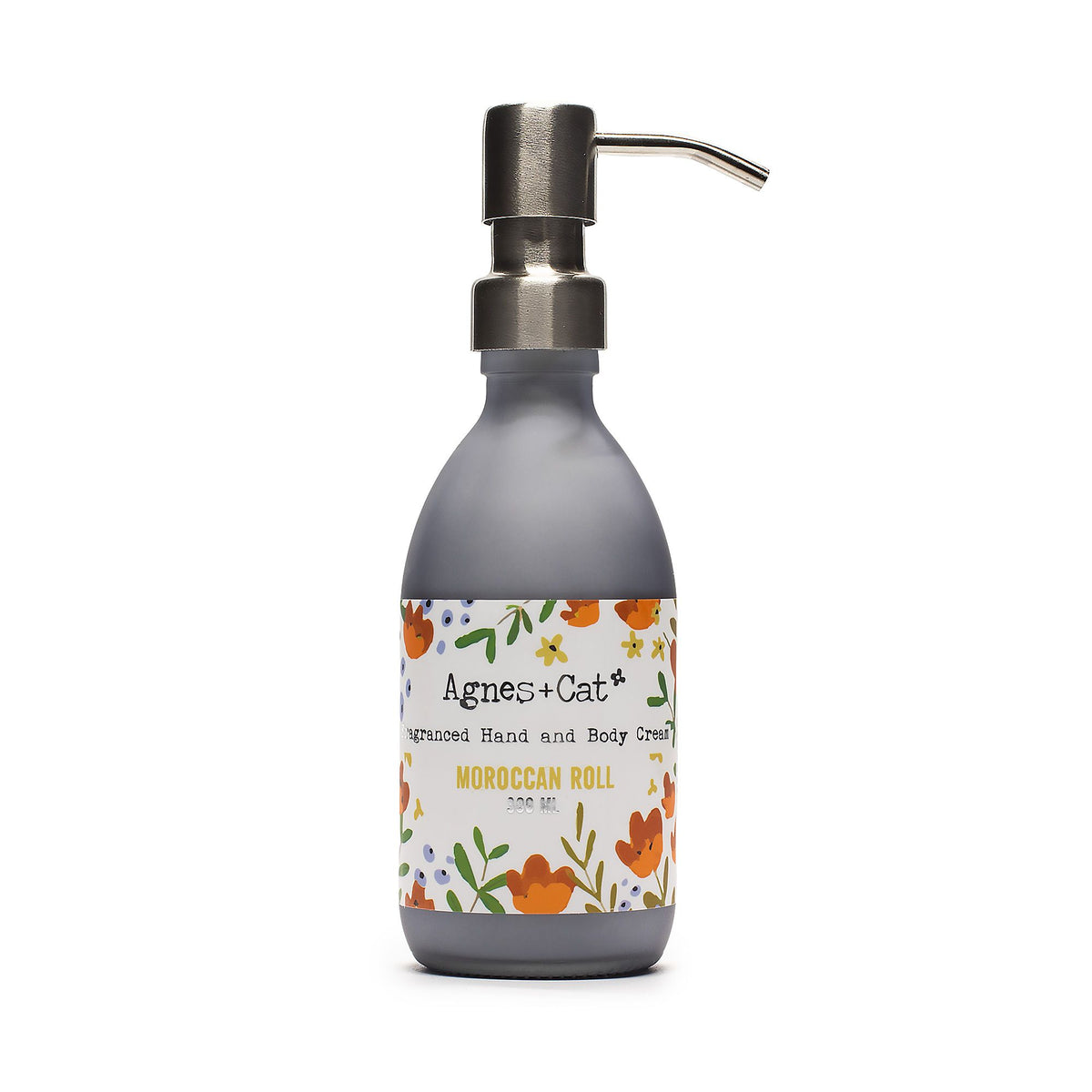Agnes + Cat Hand & Body Cream, Moroccan Roll in a grey pump bottle with a floral label, front view