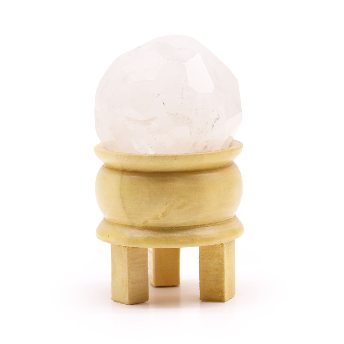 Faceted rock quartz ball on its light brown wooden stand
