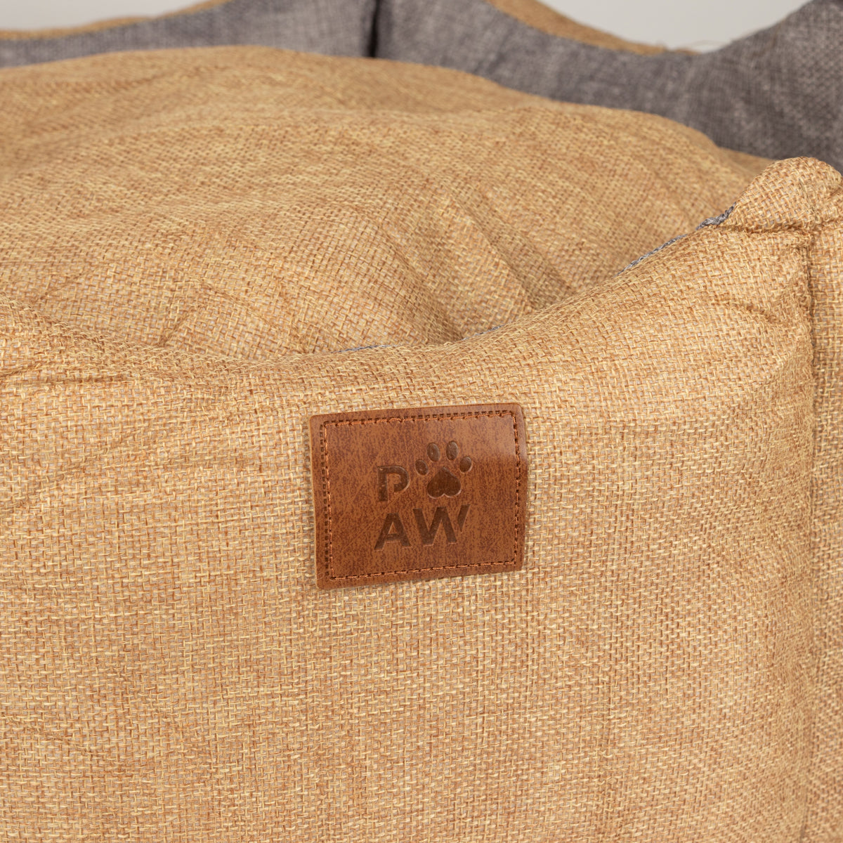 Close-up of the Paw logo on the bed’s front
