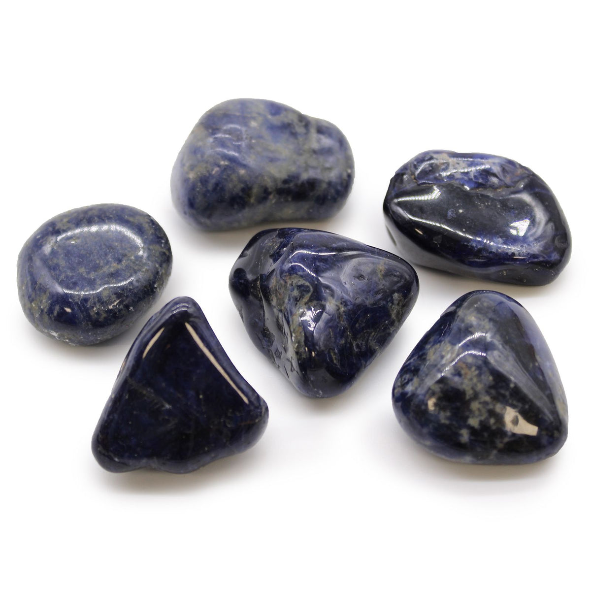 Large African Tumble Stones, Sodalite, Pure Blue, six polished blue stones on a white background