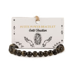 Gold Obsidian bracelet with dark polished beads on its presentation card