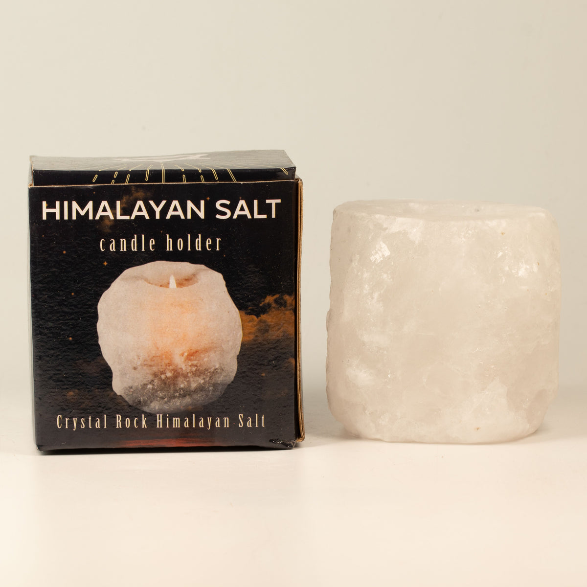 Crystal Rock Himalayan Salt Candle Holder 600-800g, pale pink holder beside its black box