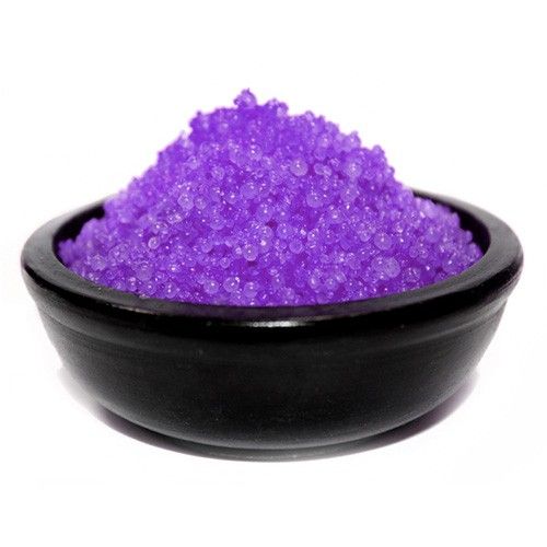 Deep Violet Musk Simmering Granules, a mound of bright purple granules in a black bowl on white
