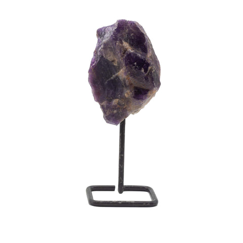 Amethyst mineral specimen on its black metal stand, front view against a white background