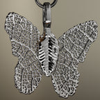 Close-up of the silver-coloured butterfly charm
