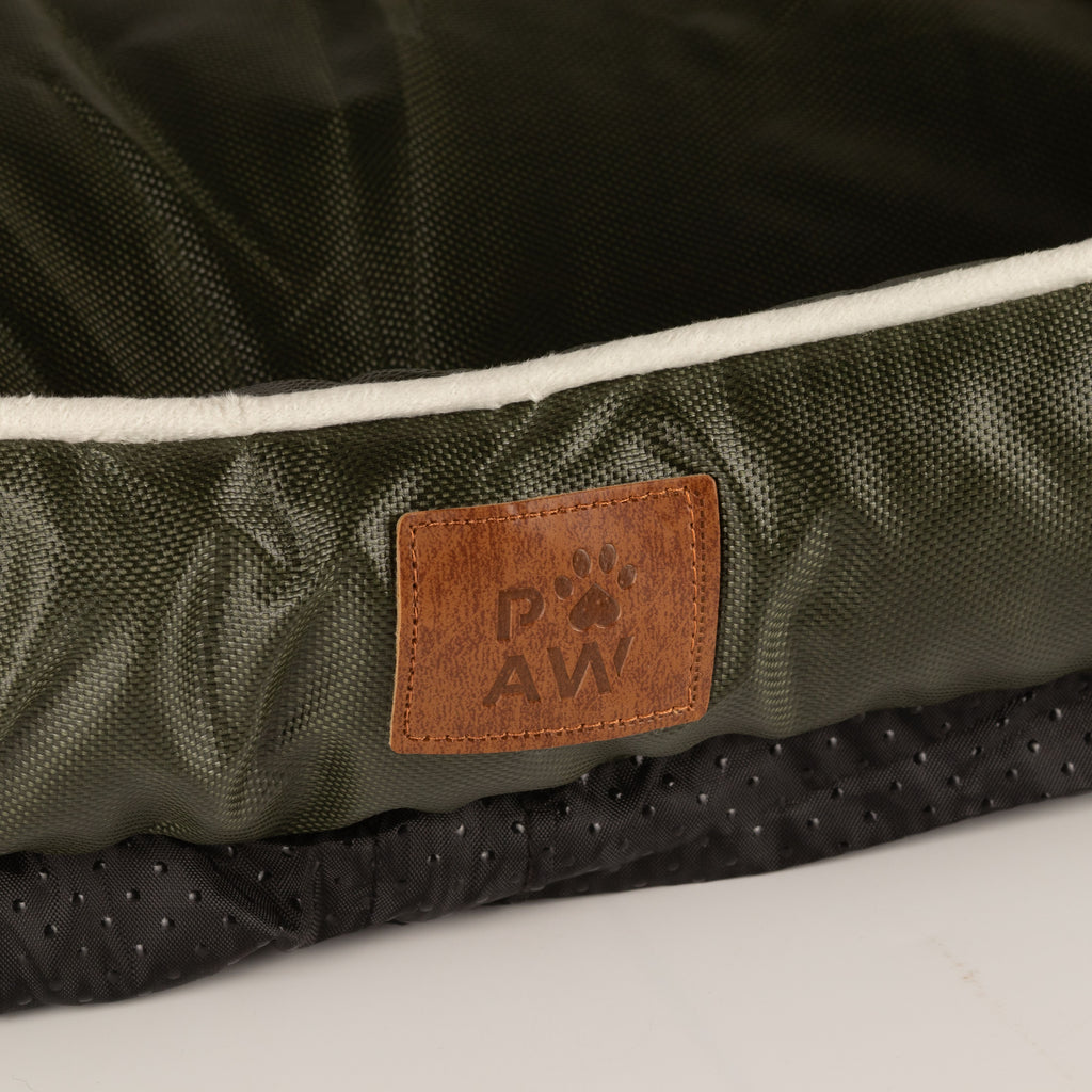 Close-up of the bed’s label and textured base