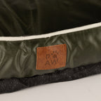 Close-up of the bed’s label and textured base