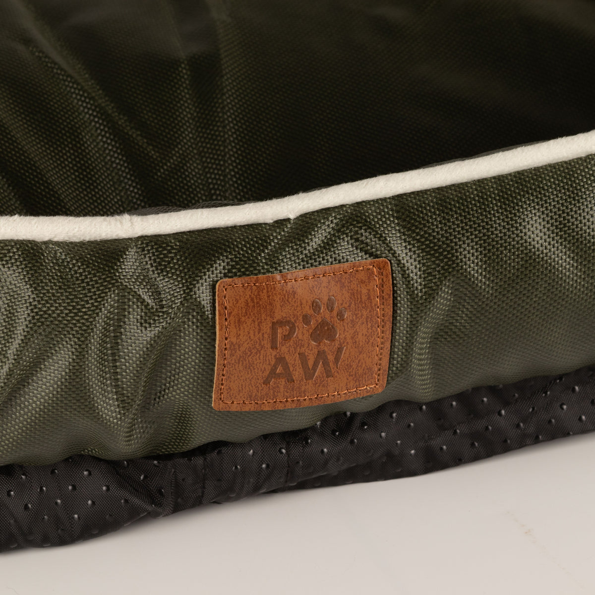 Close-up of the bed’s label and textured base