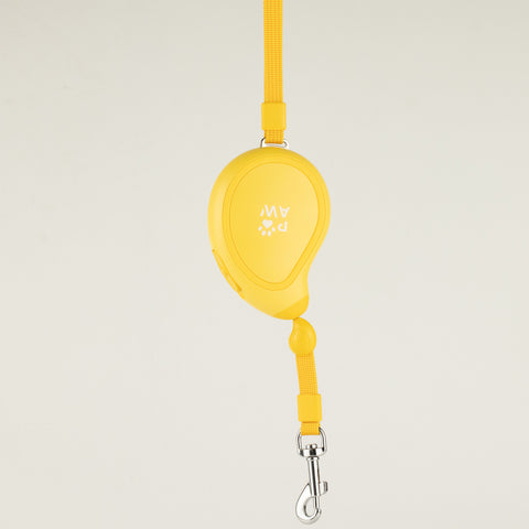 Yellow Paw Mini Mango retractable dog lead, shown hanging with wrist strap and clip