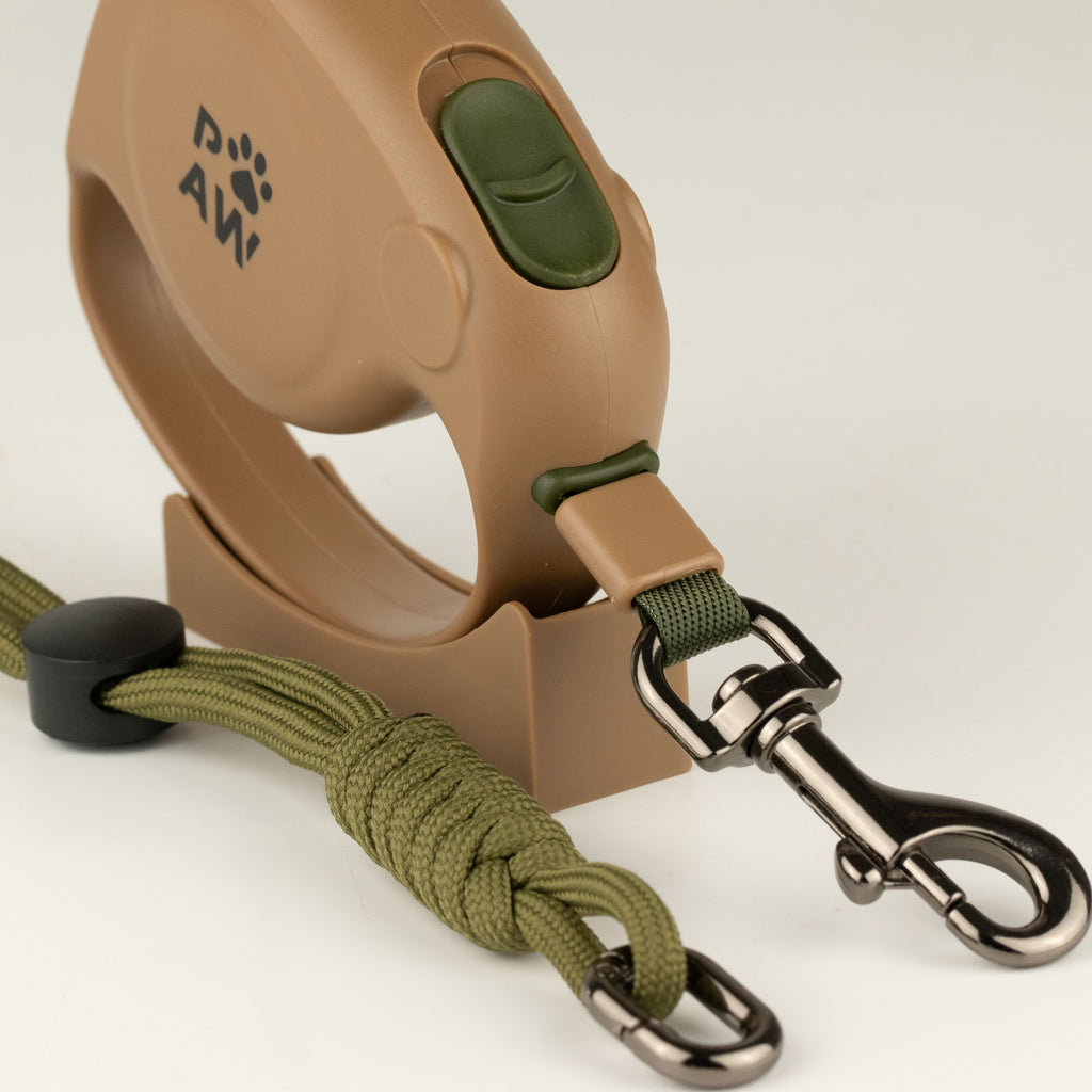 Close view of the lead control button, metal clip and rope wrist strap