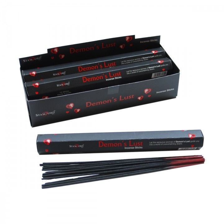 Demon's Lust Incense Sticks in black and red packaging, with an open box, a stick carton and loose sticks