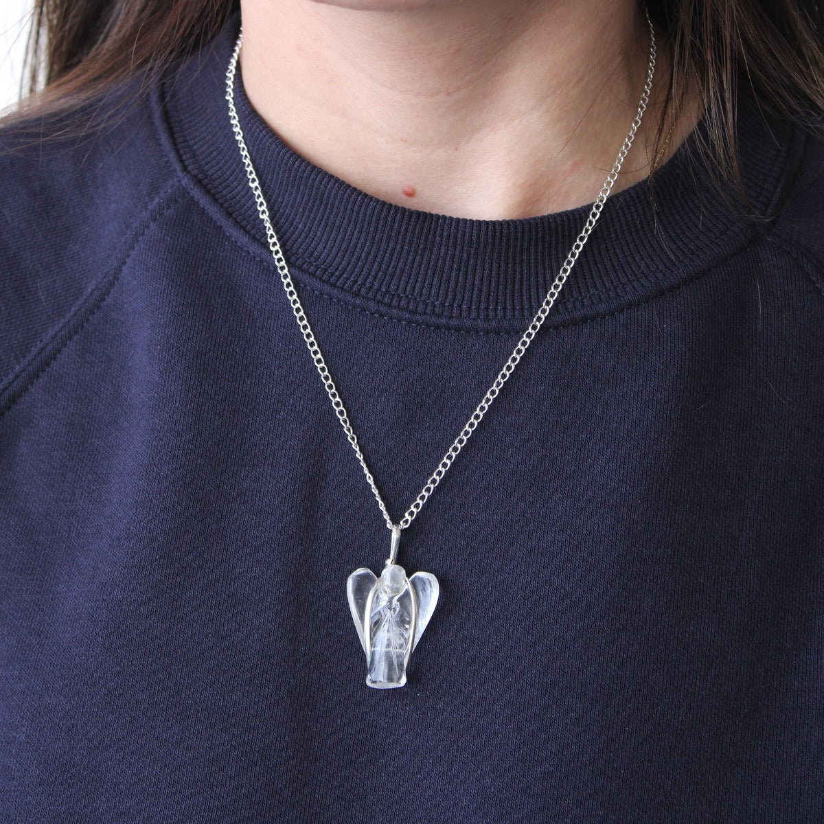 Gemstone Guardian Angel Pendant, Rose Quartz worn on a silver chain over a navy top