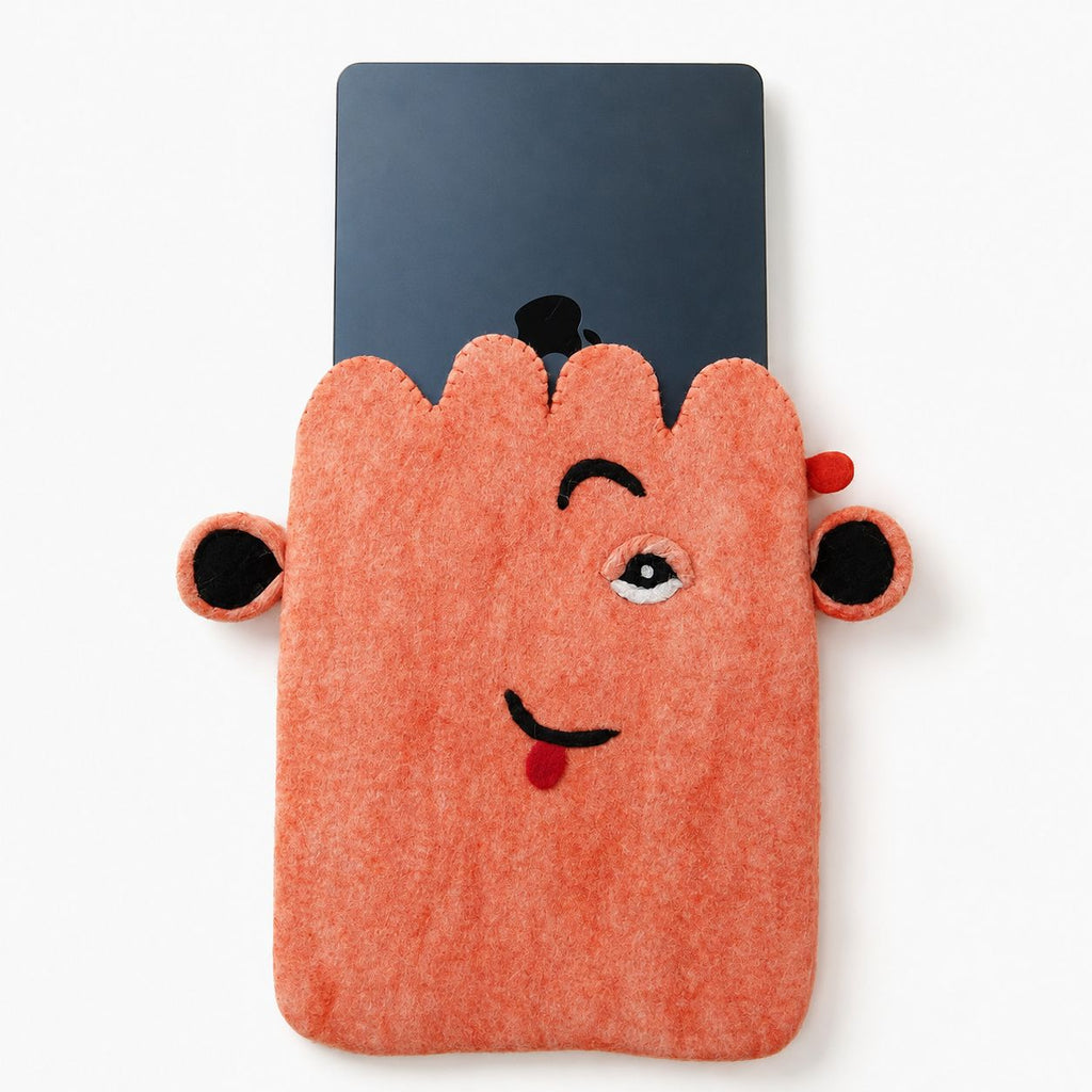 Laptop partly inside the pink felt pouch