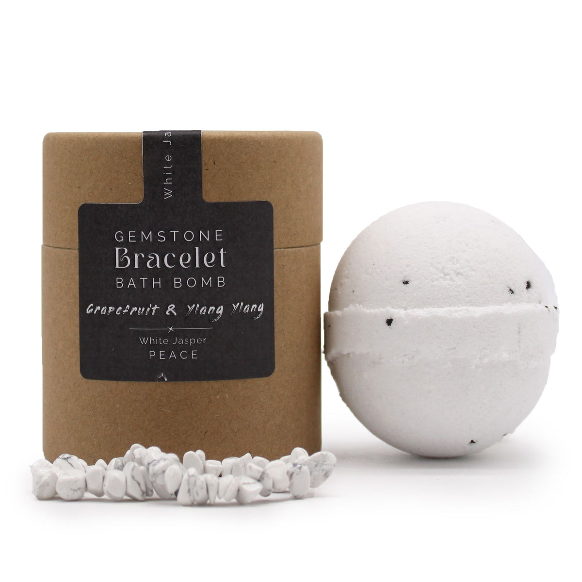 Front view of the labelled kraft container beside a white bath bomb and white jasper bracelet