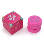 Libra zodiac bath fizzer, pink, next to its magenta gift box with scales artwork