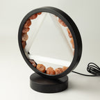 Angled view of the lamp showing its circular frame and base