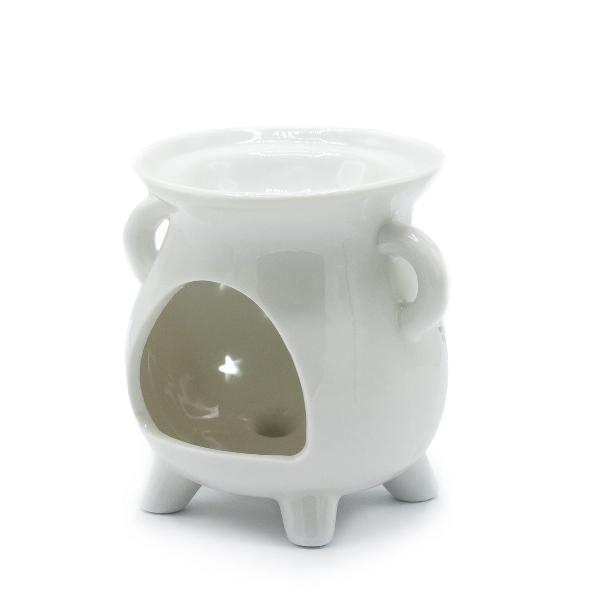 White ceramic cauldron oil burner with moon phases cut through the sides.