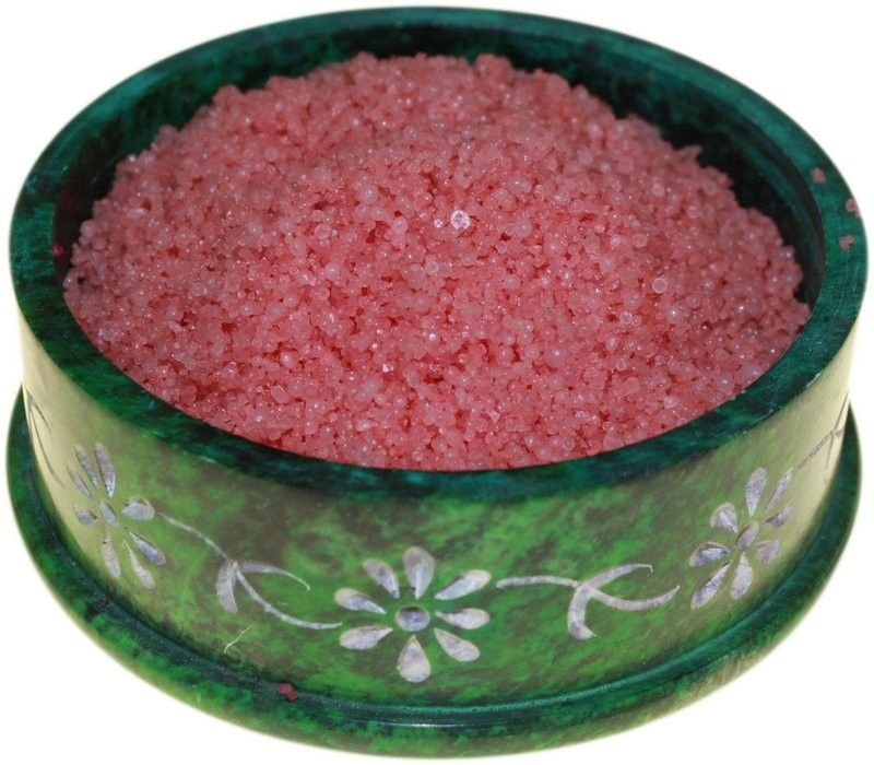 Dragons Blood Simmering Granules, pink crystals filling a green floral bowl, viewed from the front