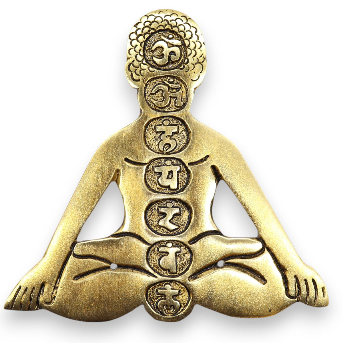 Close-up of the gold chakra yoga incense holder from the front, showing its seated figure and symbols