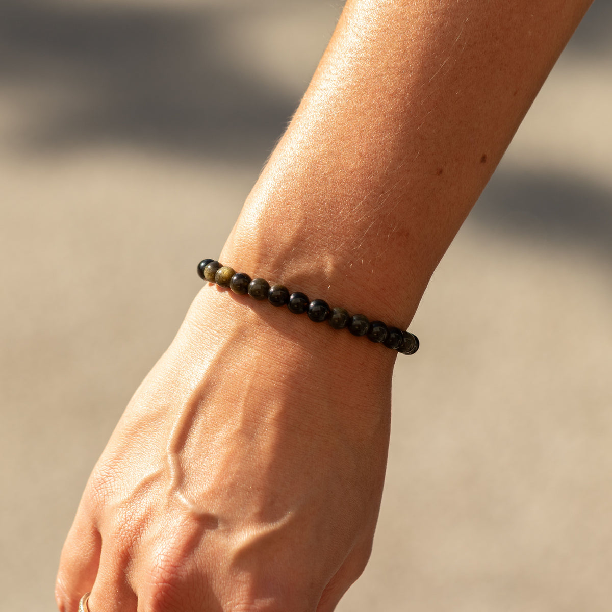 Close view of the bracelet worn around a wrist