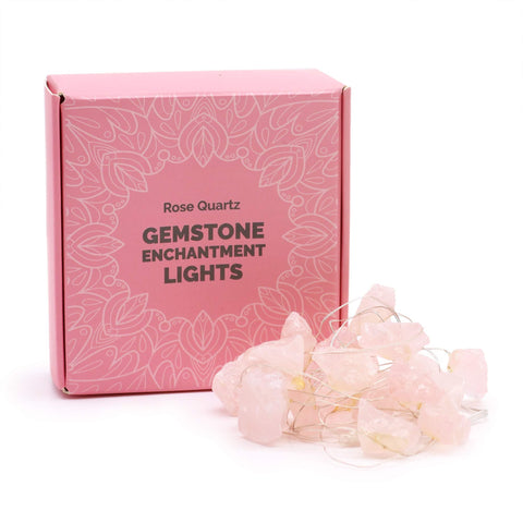 Rose Quartz Gemstone Enchantment Lights, unlit, coiled in front of their pink box