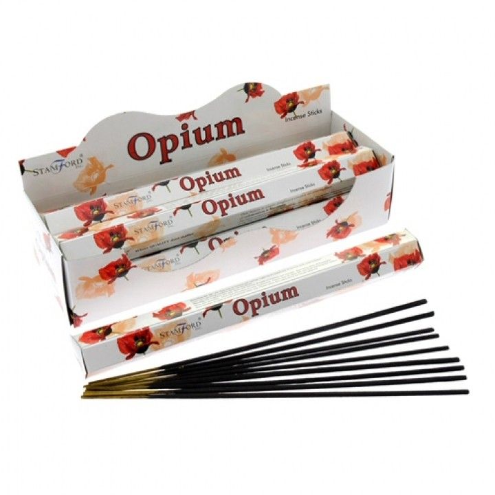 Opium Premium Incense in floral Stamford boxes, with several black incense sticks arranged in front