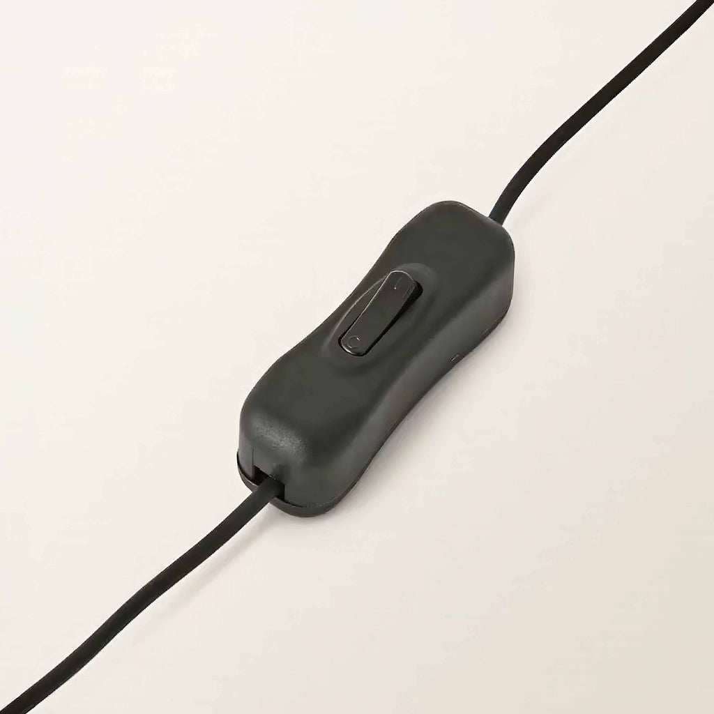 Close-up of the inline switch on the lamp's cable