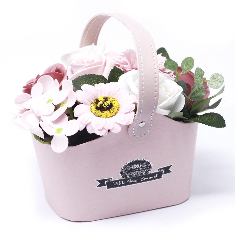 Bouquet Petite Basket, Peaceful Pink with pale pink and white flowers in a pink handled basket, front view