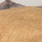 Close-up of the bed’s sand-coloured padded centre