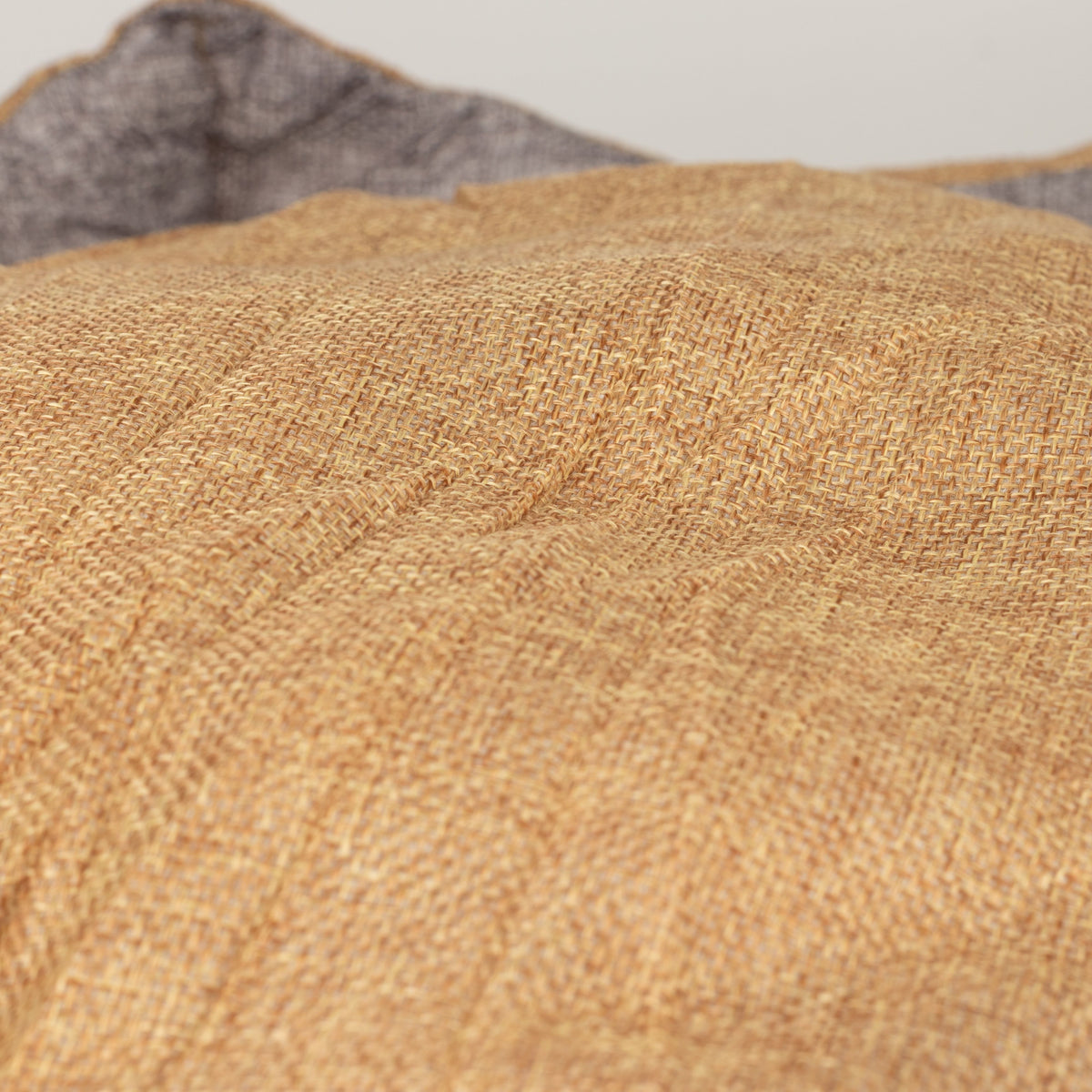 Close-up of the bed’s sand-coloured padded centre