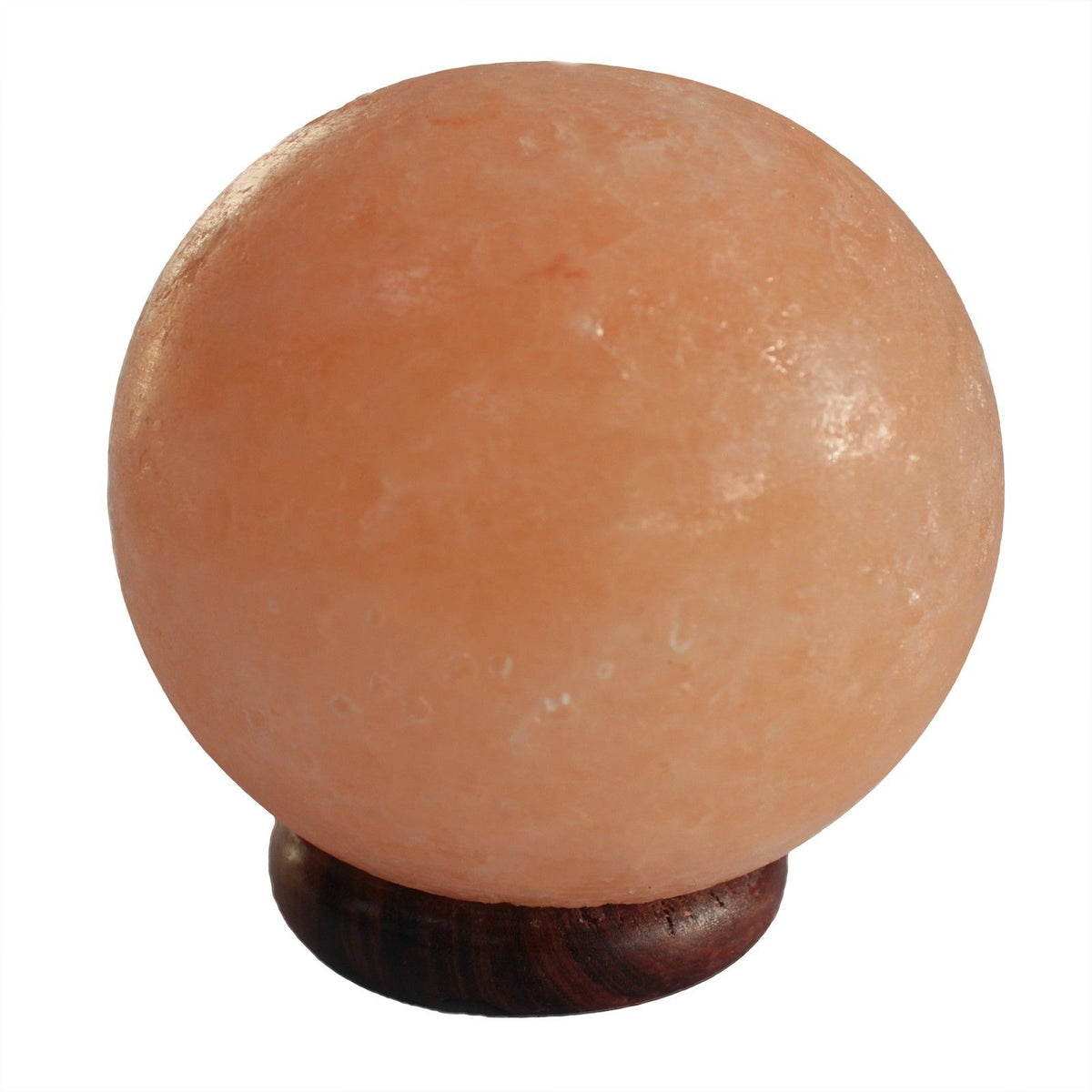 Salt lamp ball unlit, showing its peach surface and dark wooden base against a plain white background