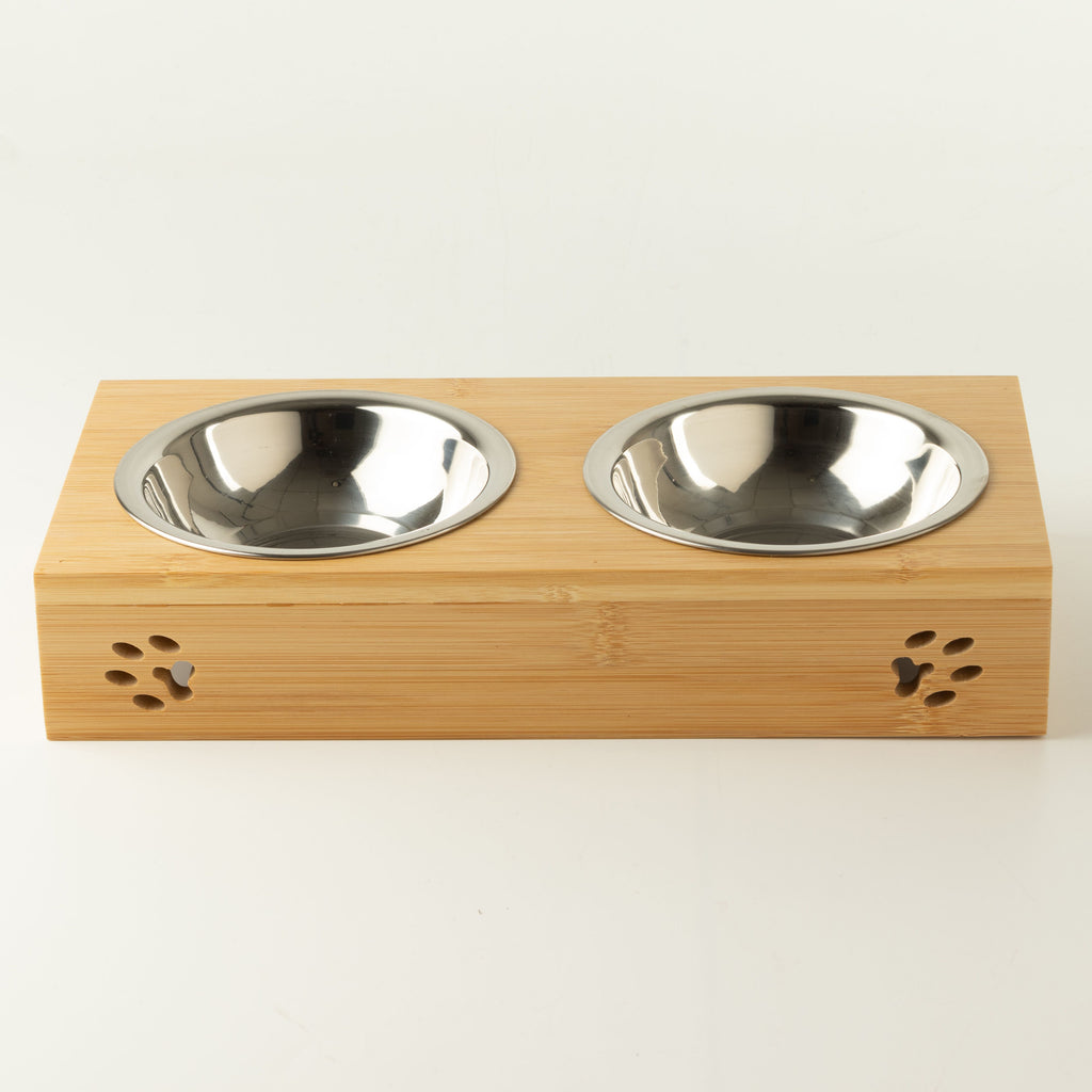 Front view of the PAW double pet bowl stand with paw-print cut-outs