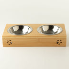 Front view of the PAW double pet bowl stand with paw-print cut-outs