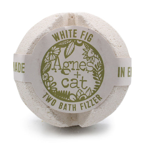 Agnes + Cat Bath Fizzer, White Fig, pale round fizzer with its printed paper band on a white background