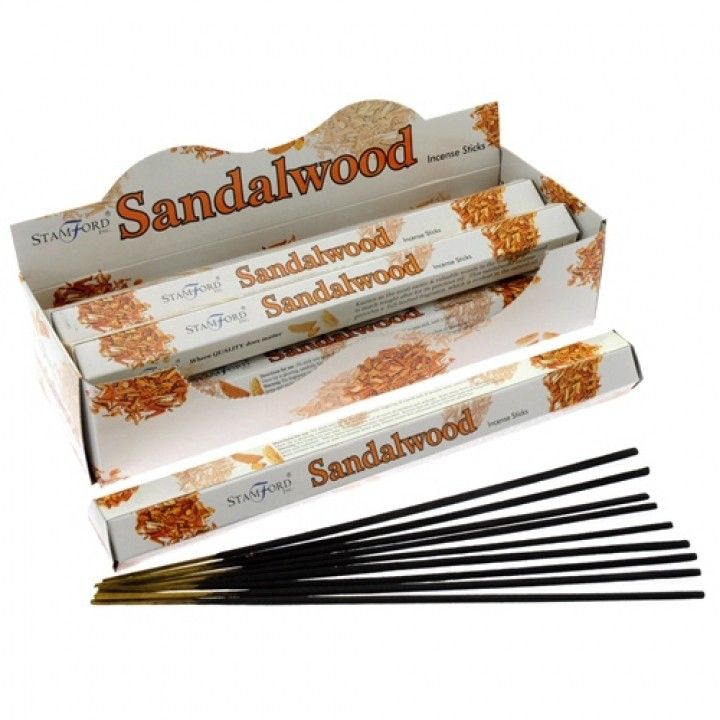 Sandalwood Premium Incense in an open Stamford box, with the printed sticks and loose dark incense sticks displayed