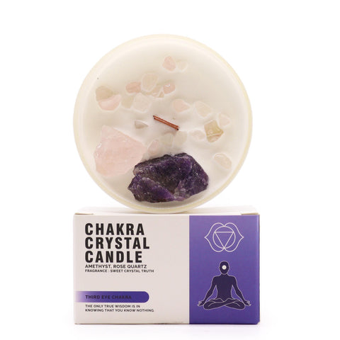 Third Eye Chakra Crystal Candle with amethyst and rose quartz on top, standing above its box