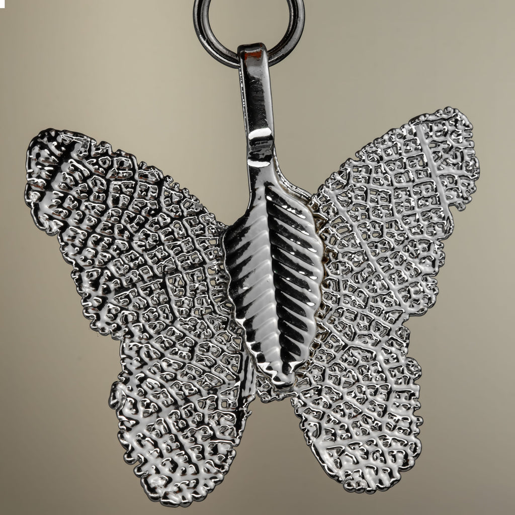 Close-up of the set's silver-coloured butterfly charm