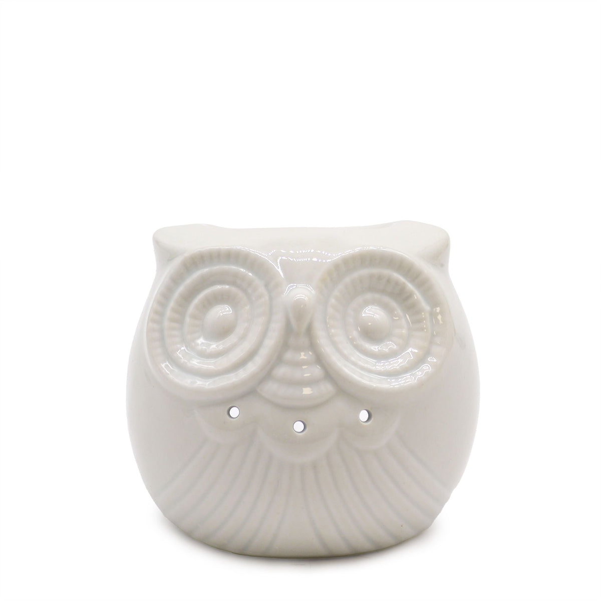 Hands holding a short, round white ceramic owl oil burner