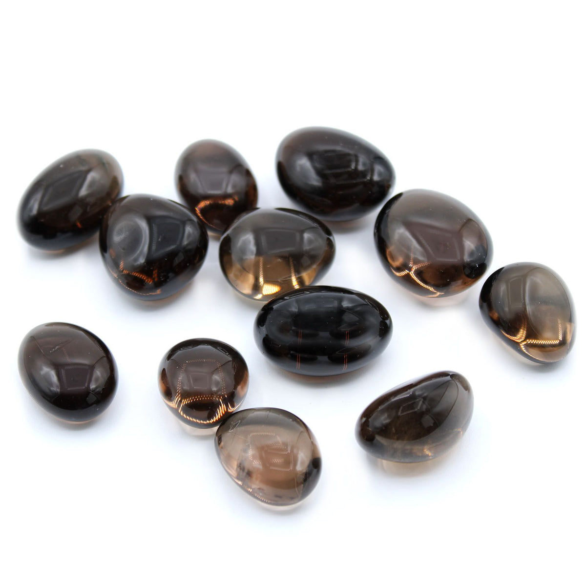 L Tumble Stones, Smoky Quartz, polished smoky brown stones scattered on a white background