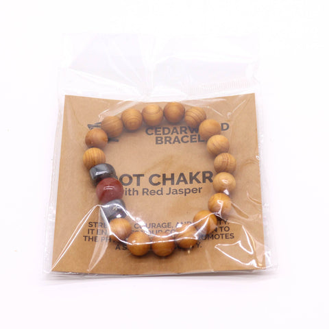Cedarwood Root Chakra Bangle with Red Jasper in a clear packet with a printed brown card, viewed from the front