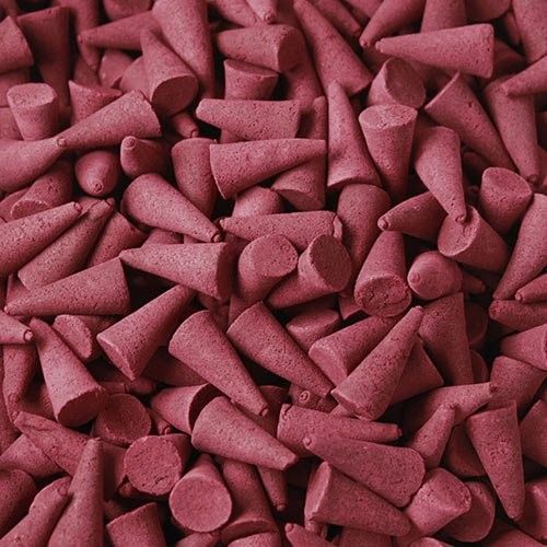 Bulk Incense Cones, Opium, a close-up of many pink cones piled together
