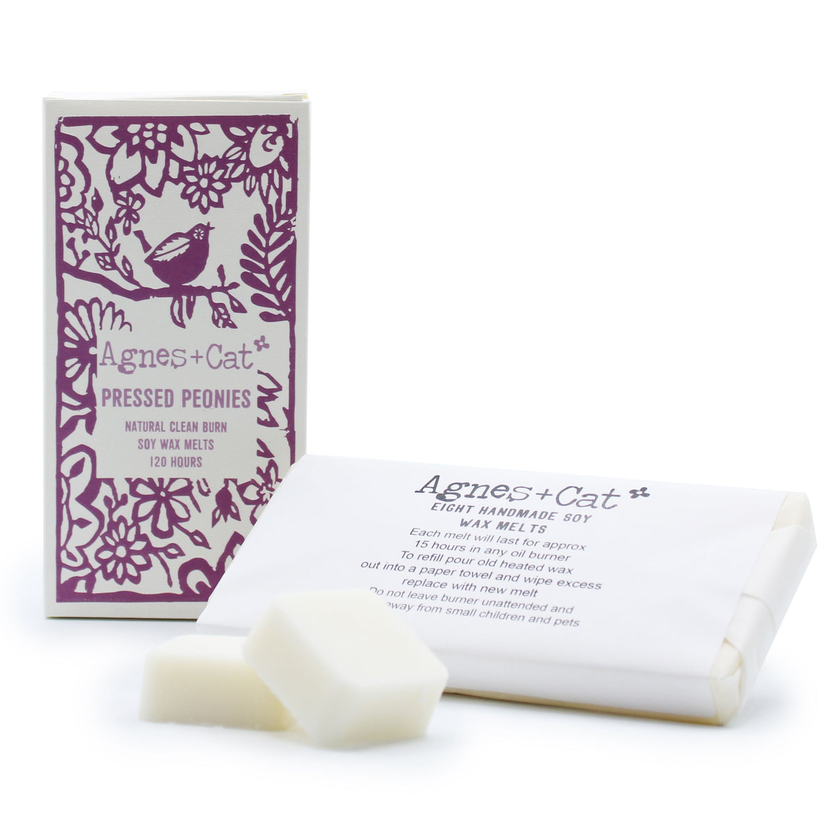 Agnes + Cat Box of 8 Wax Melts, Pressed Peonies, purple floral box beside white melts and wrapping