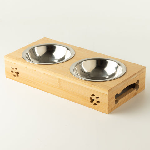 PAW double pet bowls in a wooden stand, shown from an angle