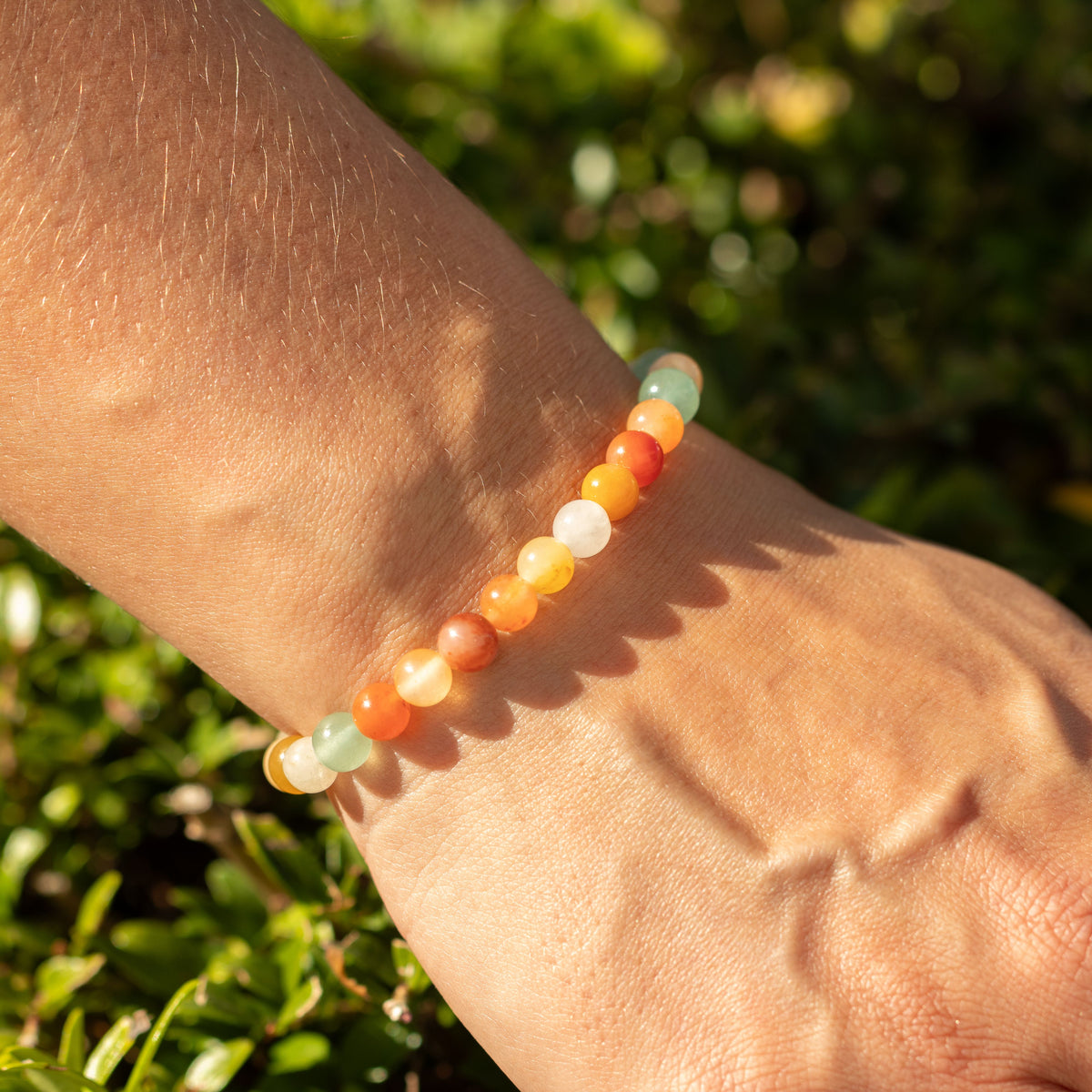 Rainbow Agate bracelet worn outdoors in sunlight