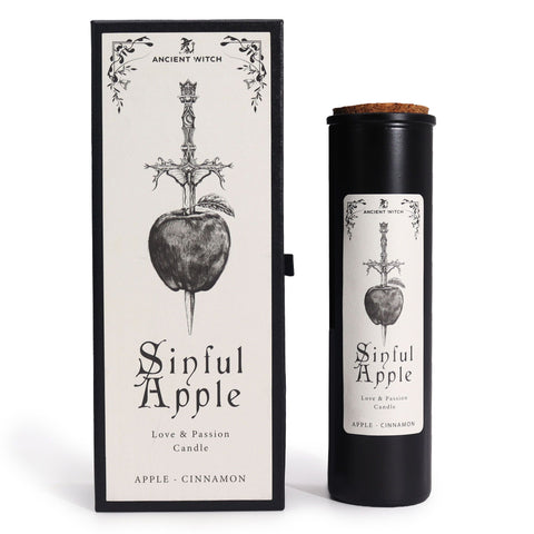 Ancient Witch Sinful Apple candle beside its box, apple and dagger design, white background