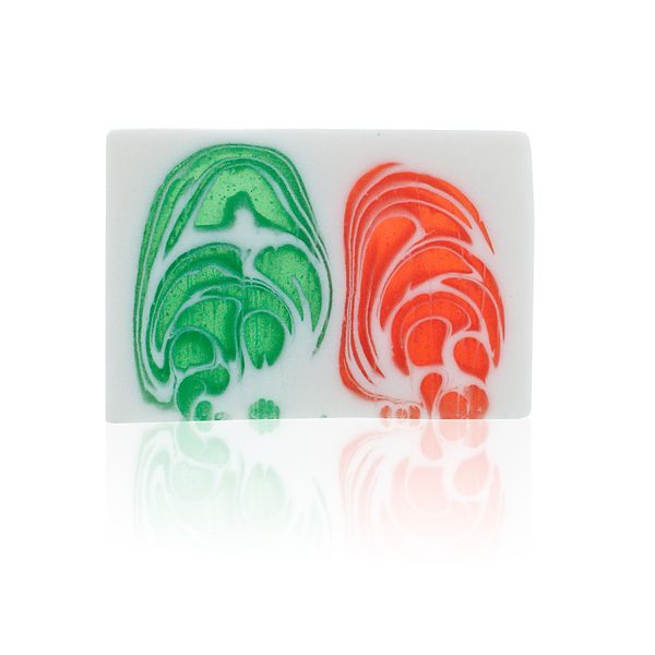 Grape soap slice shown face-on, white bar with bold green and red swirls and a reflective surface