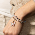 Close view of the bracelets worn on a wrist